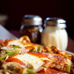 a pizza with pepperoni, mushrooms, and cheese