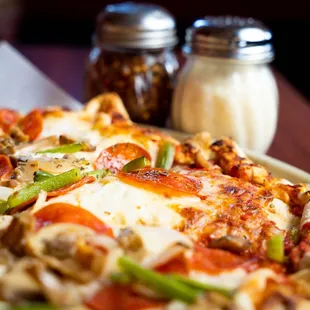 a slice of pizza on a plate