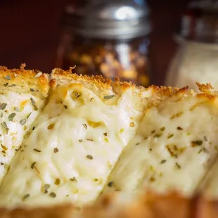 a close up of a slice of cheese bread