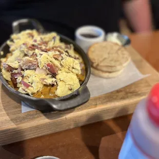 a skillet of eggs and bacon