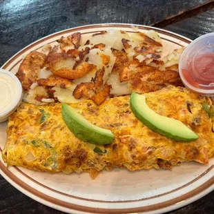 Mexicana Omelette. Has Chorizo, Onions, Green Peppers, Tomatoes, Jalapenos, and Avocado.