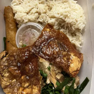 Pork lechon combo. Including garlic rice and lumpia Shanghai. Including crispy skin and moist pork.