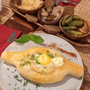 Pickle appetizer and egg topped appetizer.