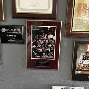 Plaques showing their accolades.