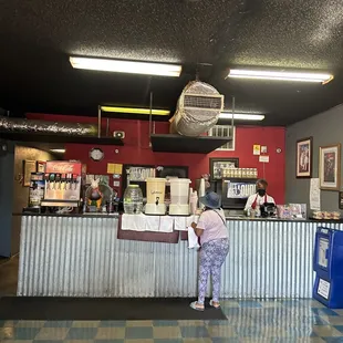 a woman standing at a counter