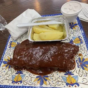 Half slab of ribs with Greek potatoes and side of 8 oz. Coleslaw