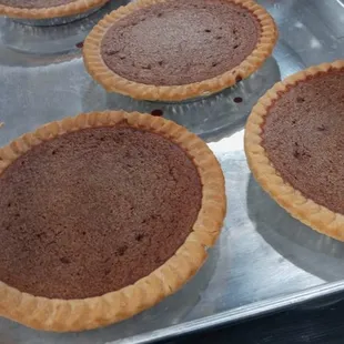 six pies on a baking tray