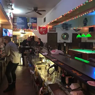 a bar with a pool table and billiards