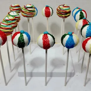 Kids birthday party cake pops made to look like beach balls