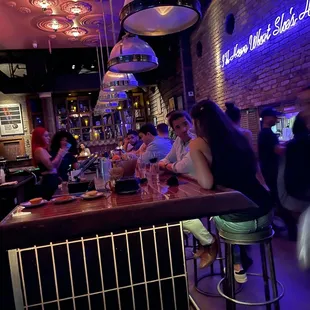 people sitting at a bar