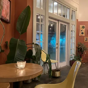 a dining area with a table and chairs