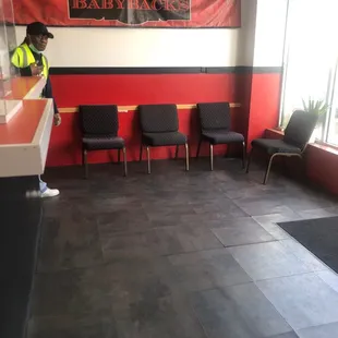 a waiting area with chairs