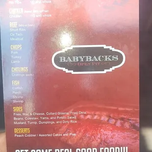 a hand holding a menu