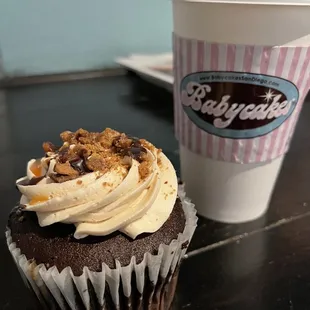 a cup of coffee and a cupcake