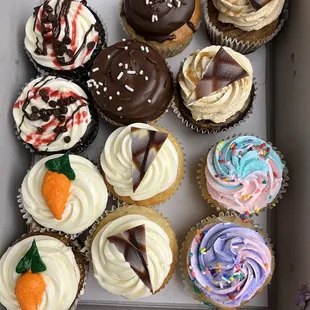 a variety of cupcakes in a box