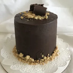 a chocolate cake on a white plate