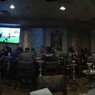 a group of people watching television