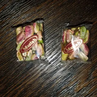 two bags of salads on a table