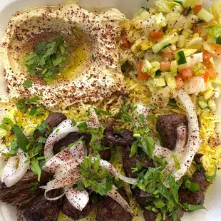 Lamb kabab platter. with rice and hummus and arab salad
