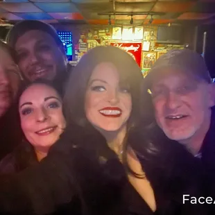 a group of people taking a selfie