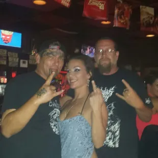 Hanging with the awesome bartender and friends .