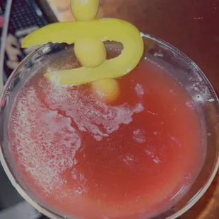 a close up of a cocktail in a martini glass