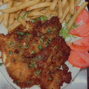 a plate of chicken tenderes and french fries