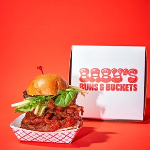 a burger with lettuce and tomato