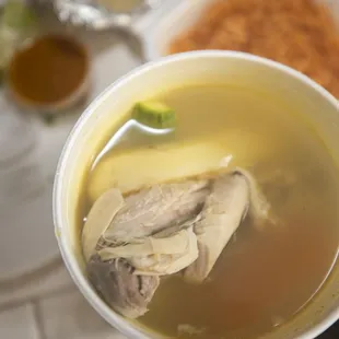 a bowl of soup and a plate of rice