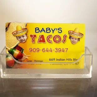 a business card in a clear holder