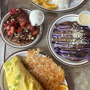 Hazelnut pancakes (half), corn beef hash, adobo fried rice, and Ube pancakes (full)