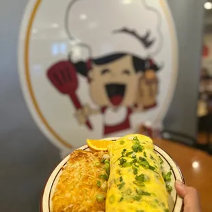 a child holding a plate of food