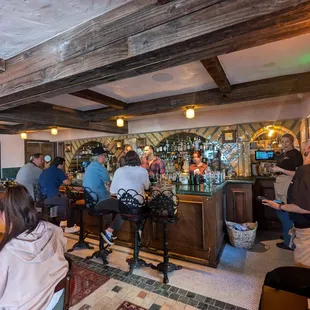 The vintage bar area with stools.