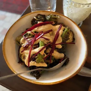 brussels sprouts caramelized, pomegranate molasses, creme fraiche, red beet