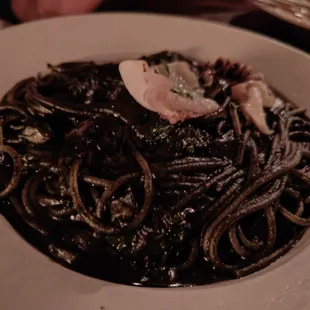 a plate of spaghetti with meat and sauce