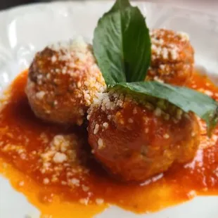three meatballs on a white plate