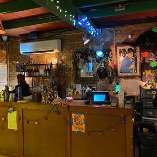 Storefront where you purchase bottles of wine, cans of beer, cheese, meat, etc.