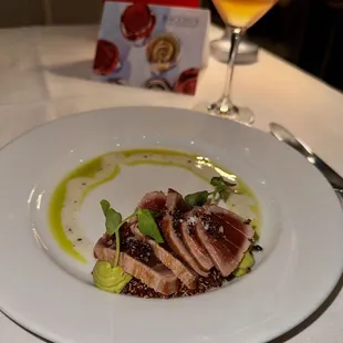 a plate of meat and vegetables