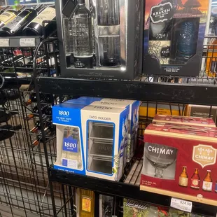 a rack of wine bottles and wine glasses