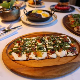 Caprese Flatbread:  pomodoro, mozzarella, roasted cherry tomatoes, fresh basil, balsamic reduction