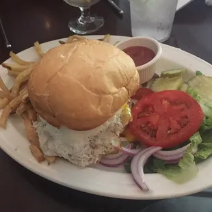 Burger with a fried green tomato and an egg