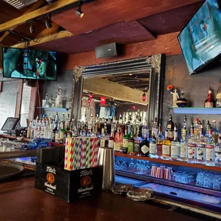 a bar with a variety of liquors