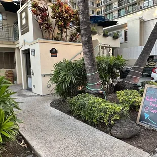 a sign in front of a building