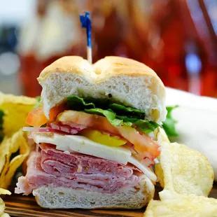 a ham sandwich with chips