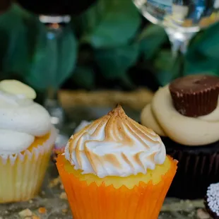 three cupcakes on a table