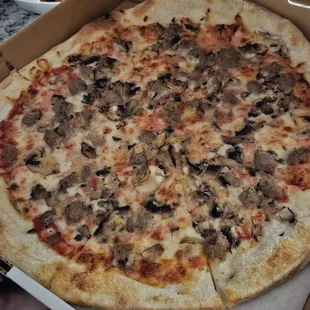 Pizza with mushrooms and sausage