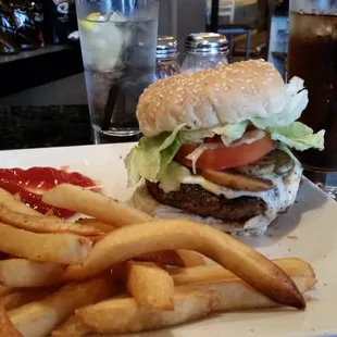 Pound of ground beef with provolone and mushrooms tomatoes lettuce all on a beautiful sesame seed roll.   Delicious!