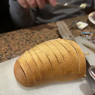 a loaf of bread on a cutting board