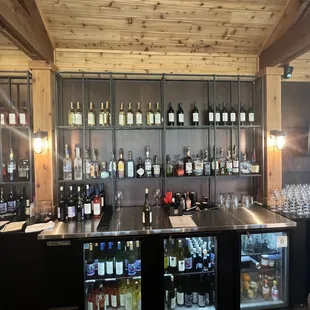 a bar with a lot of bottles of wine