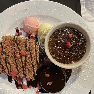 Close up of a dessert platter - tiramisu, chocolate molten cake, coffee brûlée &amp; a few scoops of ice cream!